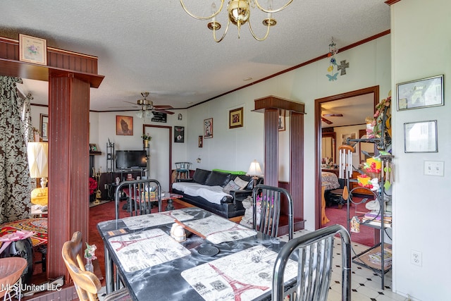 dining room featuring crown molding, decorative columns, a textured ceiling, and ceiling fan with notable chandelier
