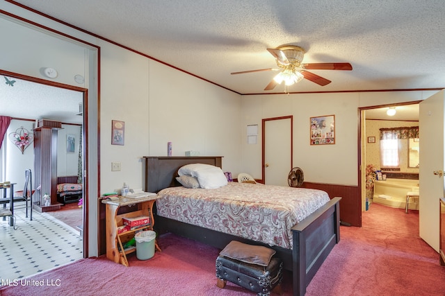 carpeted bedroom featuring ornamental molding, vaulted ceiling, a textured ceiling, and ceiling fan