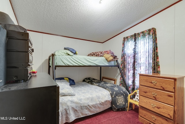 bedroom featuring ornamental molding, a textured ceiling, carpet flooring, and vaulted ceiling