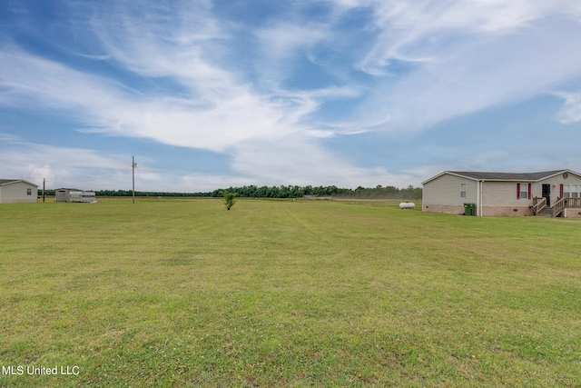 view of yard featuring a rural view