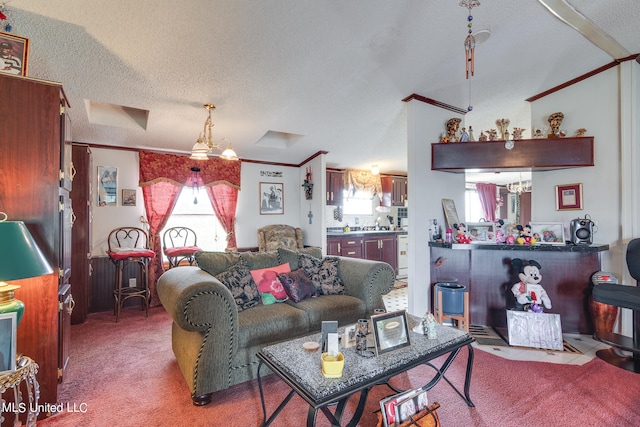 carpeted living room with ornamental molding and a textured ceiling