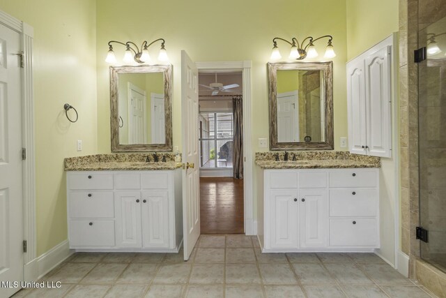 504 Carlisle Cir, Madison, MS 39110 - full bath featuring two vanities, a shower stall, and a ceiling fan