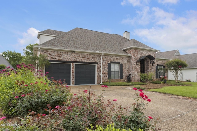 504 Carlisle Cir, Madison, MS 39110 - french country inspired facade featuring roof with shingles, a garage, concrete driveway, a chimney, and brick siding