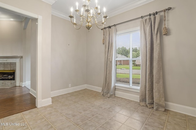 504 Carlisle Cir, Madison, MS 39110 - unfurnished dining area with crown molding, a chandelier, light tile patterned floors, and a tile fireplace