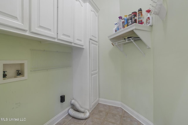 504 Carlisle Cir, Madison, MS 39110 - laundry area featuring washer hookup, cabinet space, electric dryer hookup, and light tile patterned floors