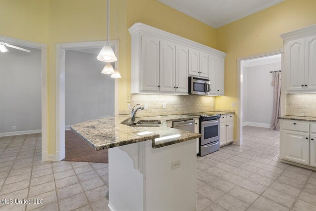 504 Carlisle Cir, Madison, MS 39110 - kitchen with stainless steel appliances, backsplash, stone countertops, a peninsula, and ornamental molding