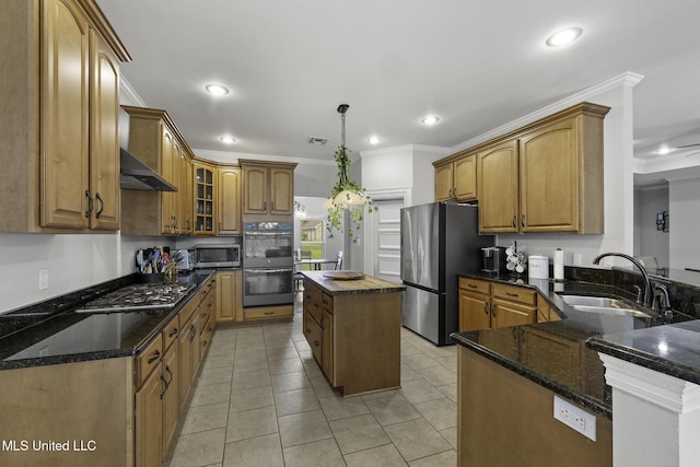 8185 Ridgewood Dr, Kiln, MS 39556 - kitchen with a sink, appliances with stainless steel finishes, ornamental molding, recessed lighting, and dark stone countertops