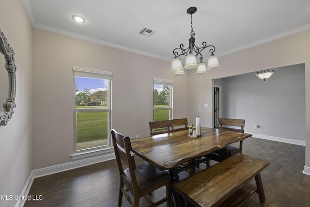 8185 Ridgewood Dr, Kiln, MS 39556 - dining space featuring a chandelier, crown molding, dark wood-type flooring, and baseboards