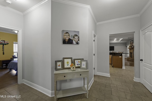 8185 Ridgewood Dr, Kiln, MS 39556 - hall with ornamental molding, tile patterned flooring, and baseboards
