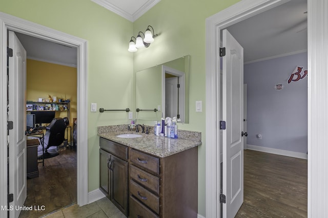 8185 Ridgewood Dr, Kiln, MS 39556 - bathroom featuring ornamental molding, wood finished floors, vanity, and baseboards