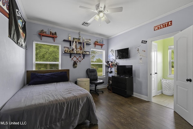 8185 Ridgewood Dr, Kiln, MS 39556 - bedroom with crown molding, wood-type flooring, ensuite bath, a ceiling fan, and baseboards