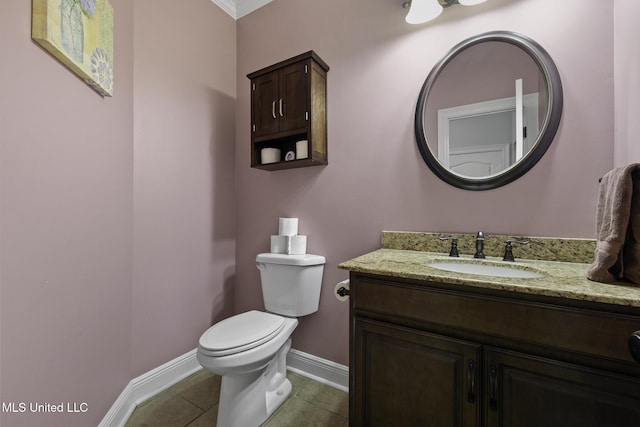 8185 Ridgewood Dr, Kiln, MS 39556 - bathroom featuring baseboards, toilet, vanity, and tile patterned floors