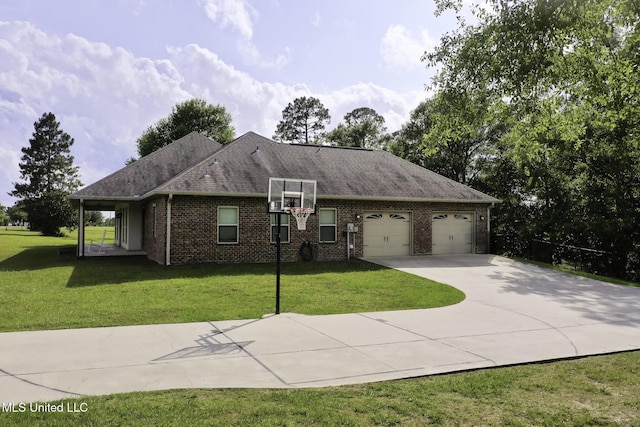 8185 Ridgewood Dr, Kiln, MS 39556 - view of side of home with driveway, a garage, a lawn, brick siding, and roof with shingles