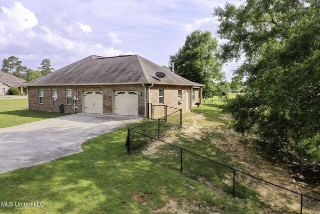 8185 Ridgewood Dr, Kiln, MS 39556 - view of front of house with an attached garage, driveway, brick siding, and roof with shingles