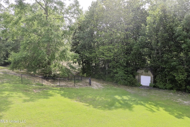 8185 Ridgewood Dr, Kiln, MS 39556 - view of yard featuring a garage