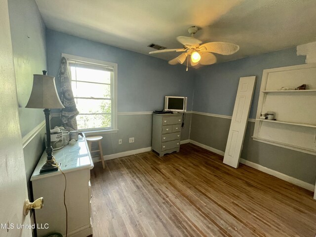 1103 N Yale St, Cleveland, MS 38732 - unfurnished office with wood finished floors, a ceiling fan, and baseboards