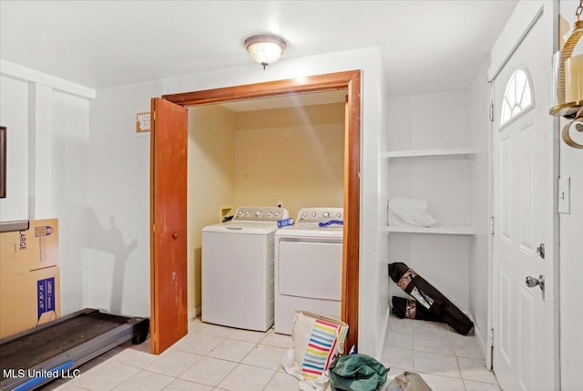 415 Dacey St, Biloxi, MS 39530 - laundry area with separate washer and dryer and light tile patterned floors