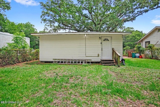 415 Dacey St, Biloxi, MS 39530 - back of property featuring entry steps and a lawn