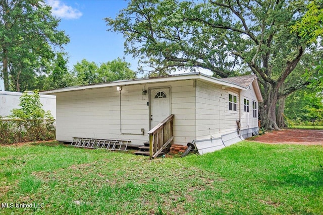 415 Dacey St, Biloxi, MS 39530 - rear view of house featuring a yard and entry steps