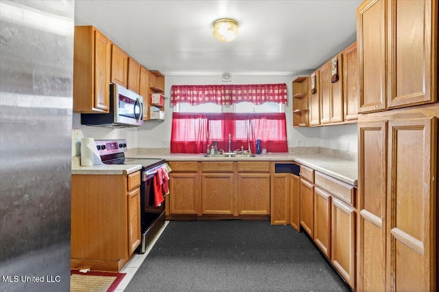 415 Dacey St, Biloxi, MS 39530 - kitchen with range with electric cooktop, open shelves, light countertops, stainless steel microwave, and brown cabinets