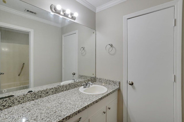 bathroom with ornamental molding and vanity