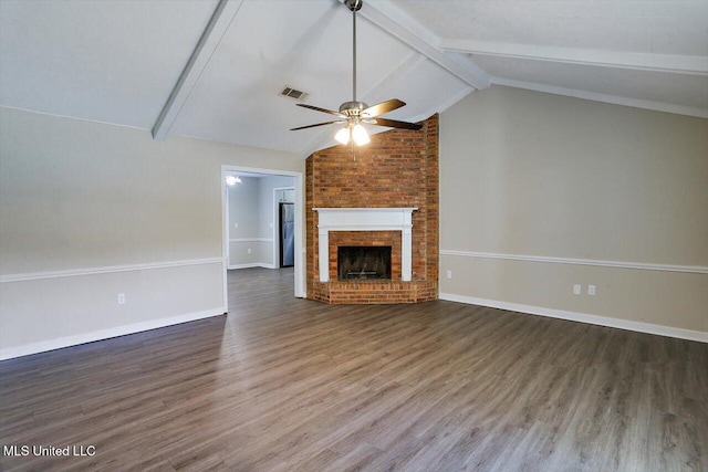 unfurnished living room featuring ceiling fan, lofted ceiling with beams, a brick fireplace, and dark hardwood / wood-style floors