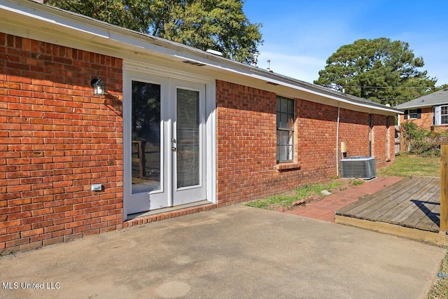 view of patio / terrace featuring a wooden deck and central AC unit