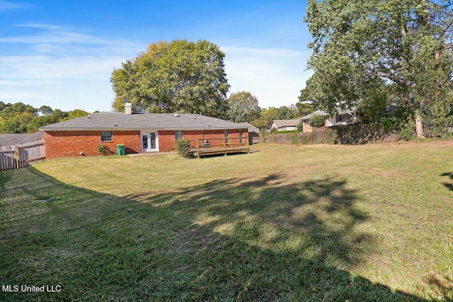 view of yard with a wooden deck