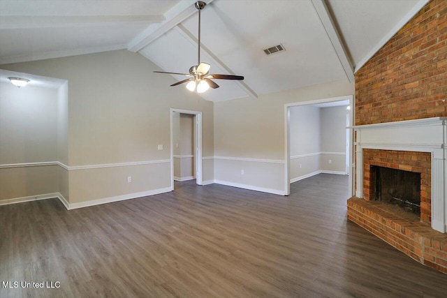 unfurnished living room featuring ceiling fan, dark hardwood / wood-style flooring, high vaulted ceiling, beamed ceiling, and a fireplace