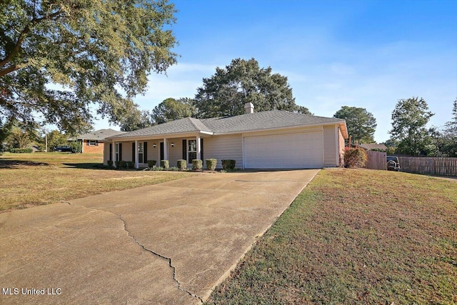 ranch-style home with a garage and a front yard