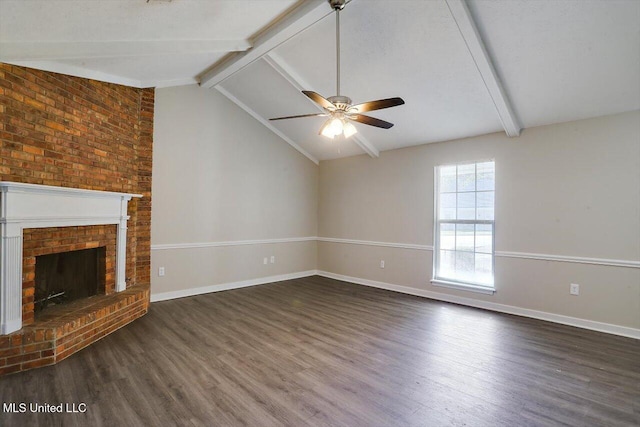 unfurnished living room featuring ceiling fan, dark hardwood / wood-style floors, a brick fireplace, and vaulted ceiling with beams