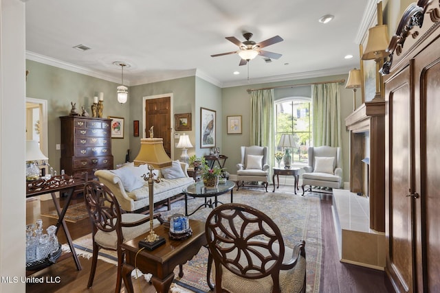 150 Harper St, Ridgeland, MS 39157 - living room with a ceiling fan, dark wood-style flooring, crown molding, a fireplace, and recessed lighting