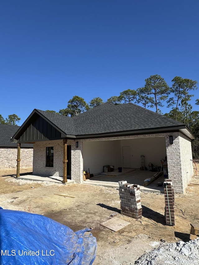 back of house with a patio area