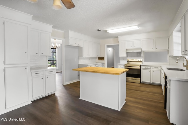 kitchen featuring white cabinetry, stainless steel electric range oven, a kitchen island, and sink