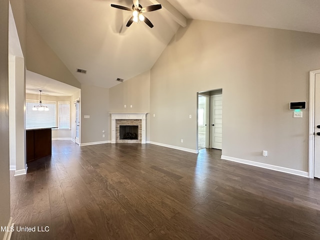 unfurnished living room featuring dark hardwood / wood-style flooring, ceiling fan with notable chandelier, beam ceiling, high vaulted ceiling, and a fireplace