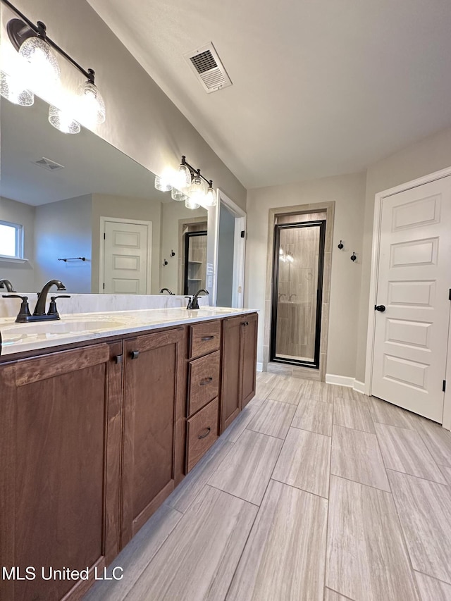 bathroom with vanity and walk in shower