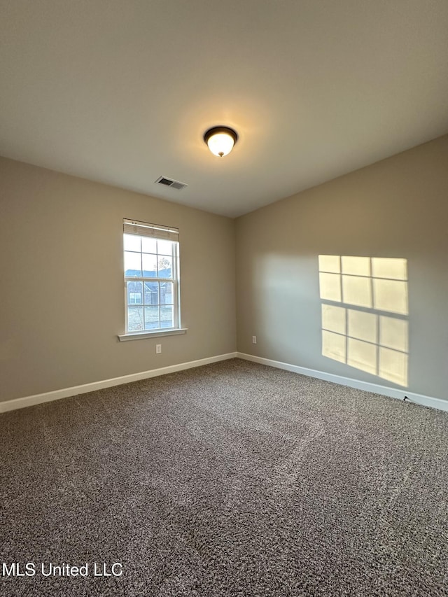 unfurnished room featuring carpet flooring