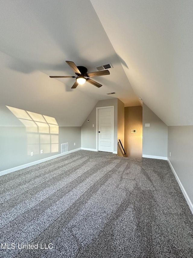 bonus room with carpet flooring, ceiling fan, and vaulted ceiling