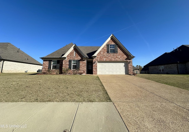 view of front of house with a front lawn and a garage