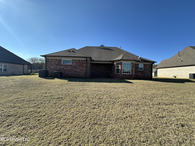 rear view of house with central AC