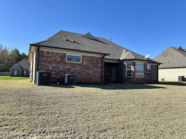 back of property with central AC