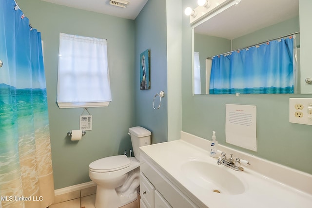 bathroom featuring tile patterned flooring, vanity, a shower with shower curtain, and toilet