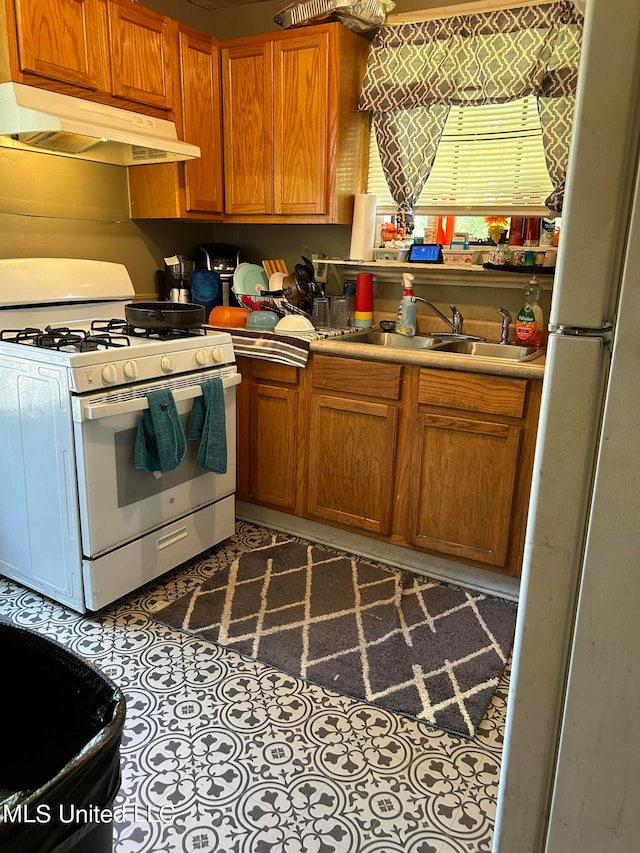 kitchen with sink and white appliances