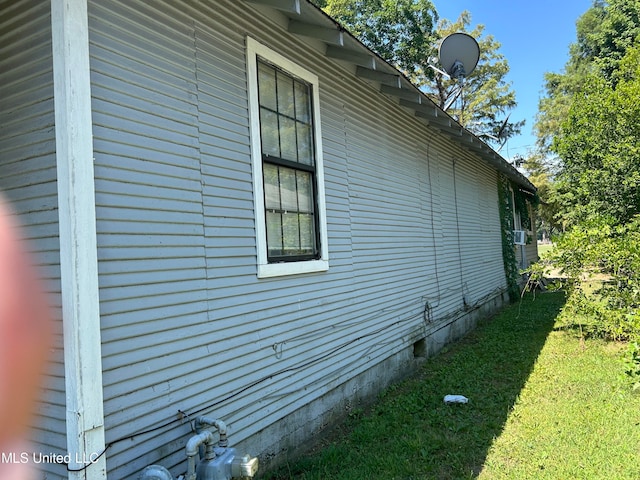 view of home's exterior featuring a lawn