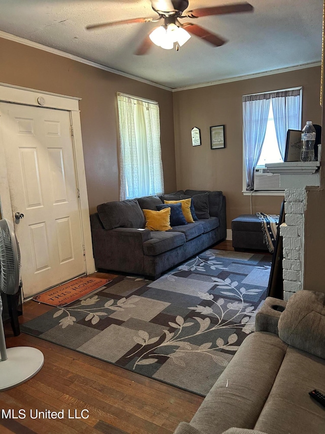 living room with ornamental molding, hardwood / wood-style floors, cooling unit, and ceiling fan