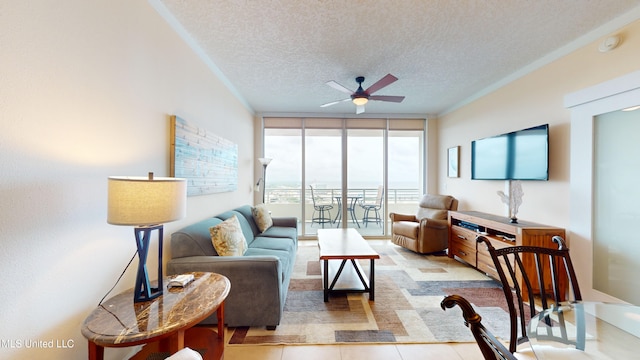 living room with floor to ceiling windows, a textured ceiling, ceiling fan, and light tile patterned floors