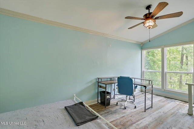 office space featuring lofted ceiling, a ceiling fan, wood finished floors, and crown molding