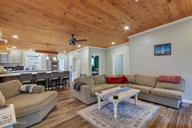 living room with recessed lighting, wood finished floors, ornamental molding, wood ceiling, and ceiling fan