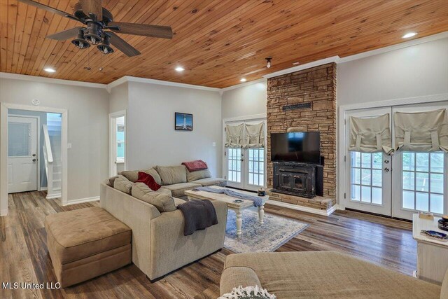 living area featuring a healthy amount of sunlight and crown molding