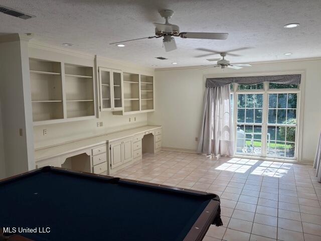 playroom with pool table, ornamental molding, and light tile patterned flooring